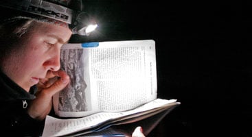 Reading the Pacific Crest Trail guidebook by night. Photo by Philipp Kobel