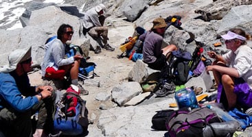 Thru-hikers snack and chat in the Sierra Nevada. Photo by Brandon White