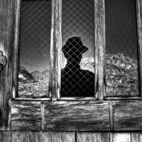 2013 Photo Contest - Human Spirit - Third Place Muir hut reflects the silhouette of a hiker during a brief lunch stop after achieving the summit of Muir Pass, Sierra Nevada, Calif. Photo by: Ryan Weidert