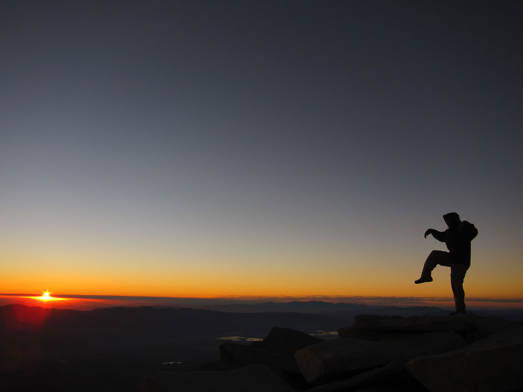 A John Muir Trail thru-hiker on the summit of Mt. Whitney. Photo by Jack Haskel