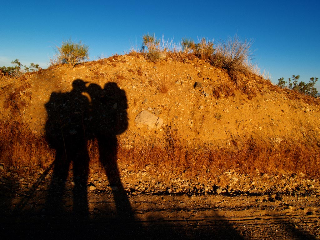 Aaron and Nathalie kissing in the Mojave. [Photo by Aaron Doss]