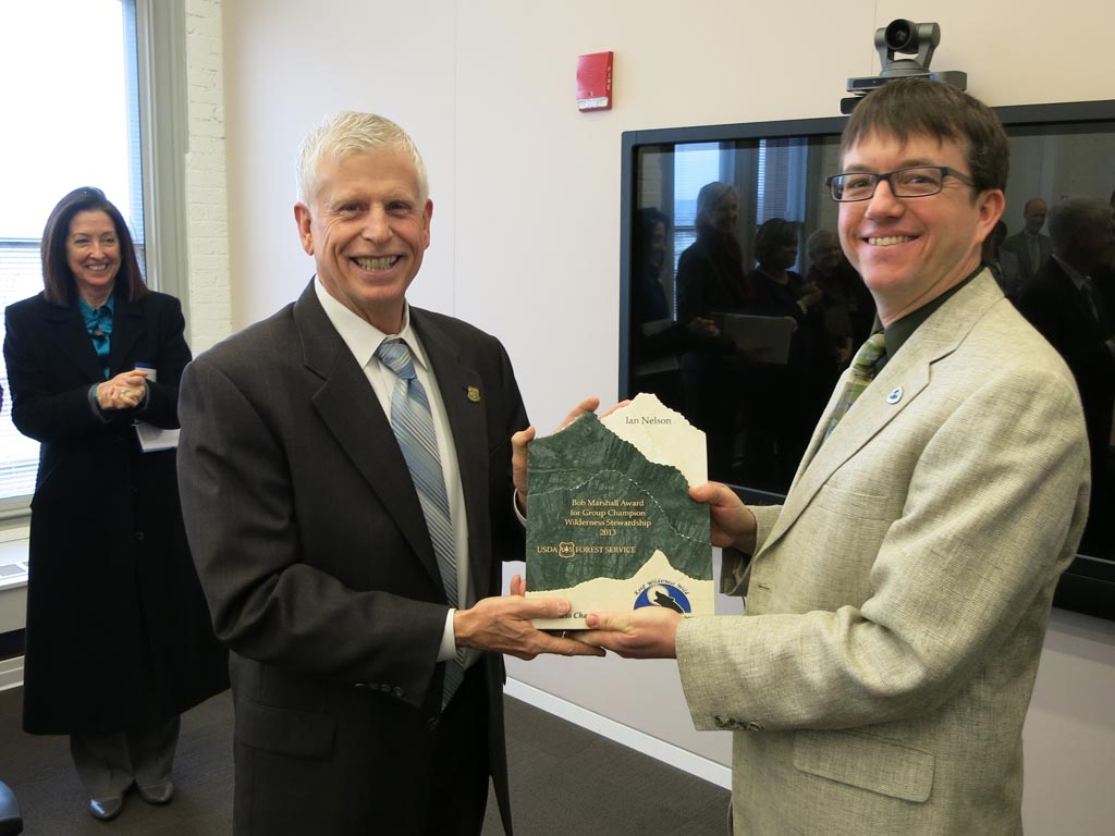U.S. Forest Service Chief Tom Tidwell presents Ian Nelson (right) with the Bob Marshall Award. Associate Chief Mary Wagner is at left. (Photo by Mark Larabee, PCTA)  