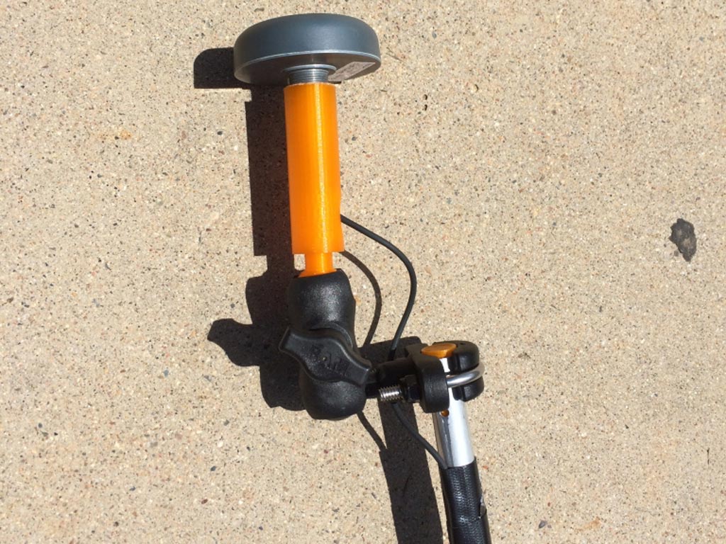 This is top of the antenna mount. The orange "pipe" was 3D printed. It connects the antenna to the adjustable angle clamp. We actually printed two sides, but the side that goes into the pipe proved to be too fragile, and we had to resort to a heavier pipe clamp.