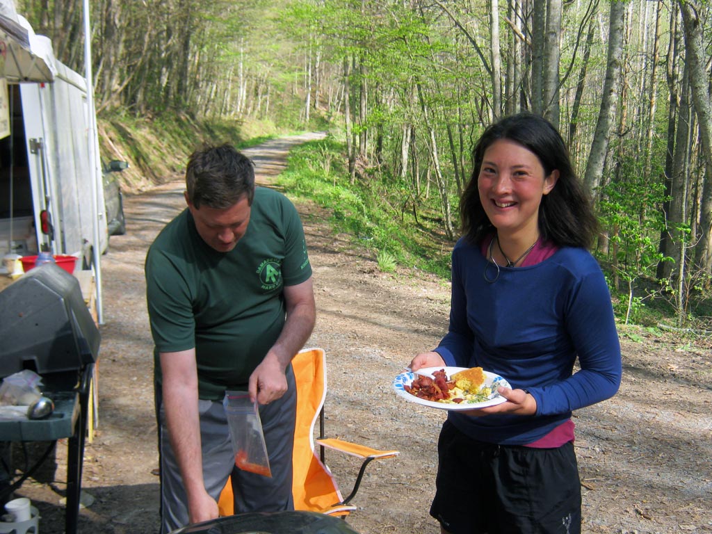 Liz Thomas enjoying a free meal from the Rat Pack (a group of trail maintainers) at Brown Gap on the Long Trail.