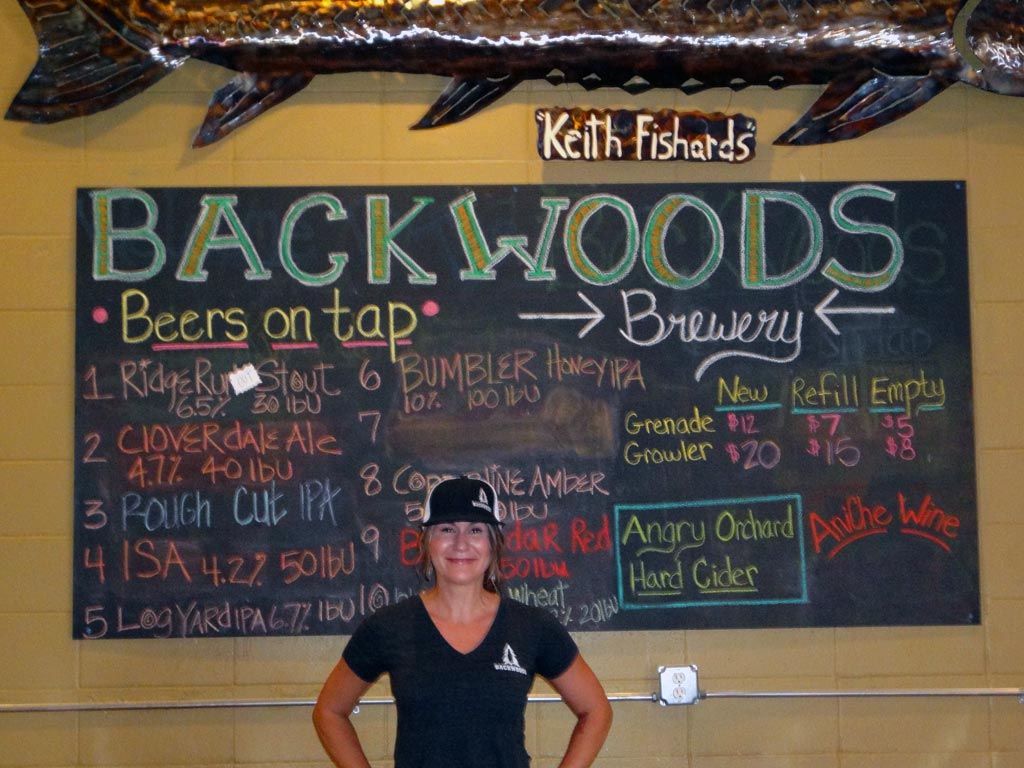 Greta Hollis, a friendly face at Backwoods Brewing, treats hikers really hard well.