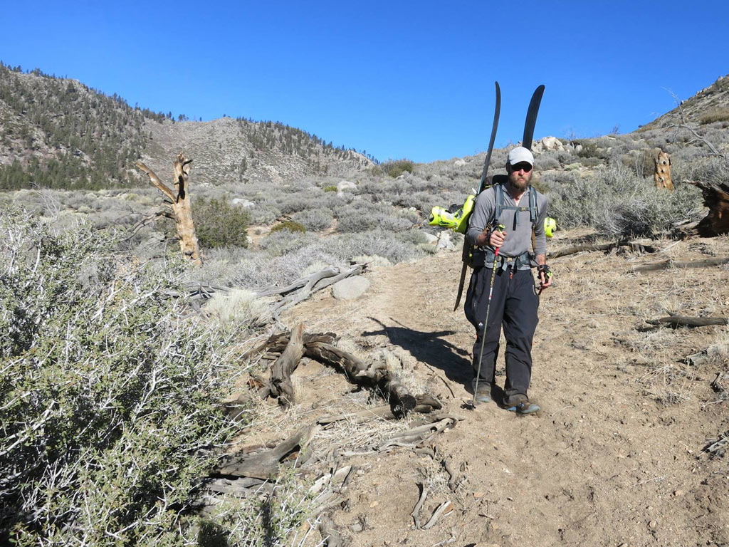 Walking dry trail in the Southern Sierra, with skis on back, is a sign of the terribly dry winter the western United States is experiencing.