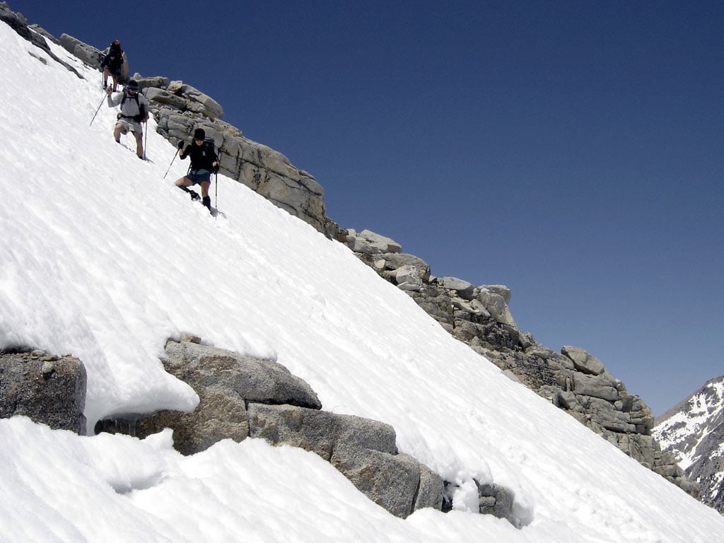 Firm snow can linger well into summer on the northern reaches of the PCT. Hikers should wait for the snow to melt unless they have the skills and tools needed for crossing steep and dangerous snow-covered slopes, where the risk of a fall can be significant