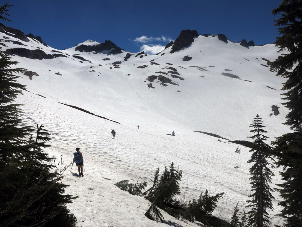 Crossing a snowfield in the Glacier Peak Wilderness in mid-July 2014. Photo by John Haffner. 