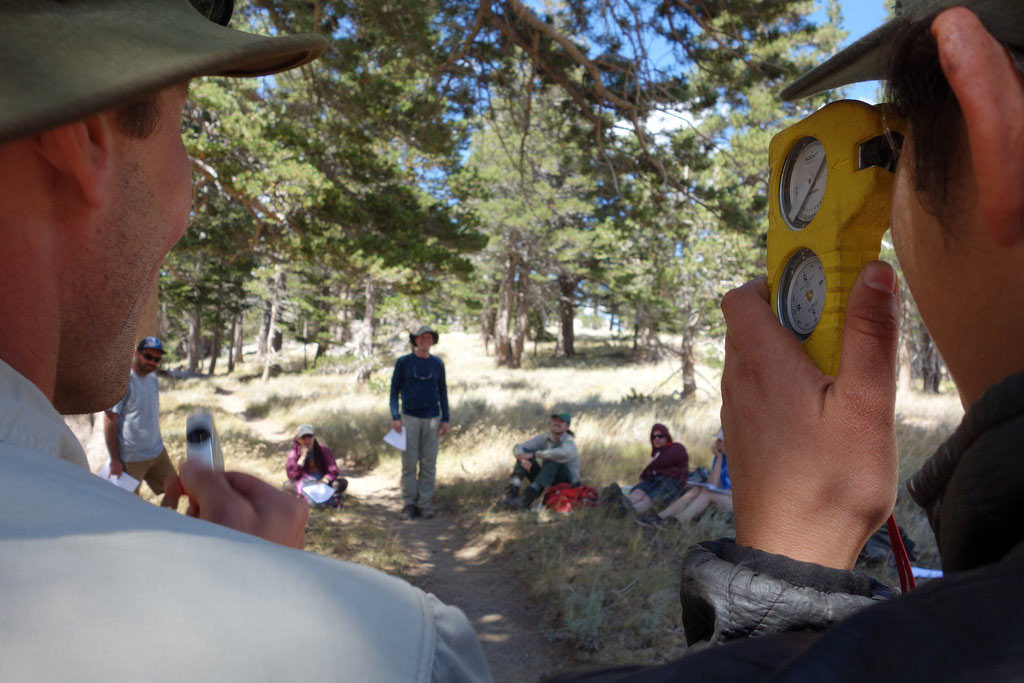 Using an inclinometer to measure slope angle on the trail. We keep it low angle, primarily to avoid erosion problems when it rains or snow is melting.