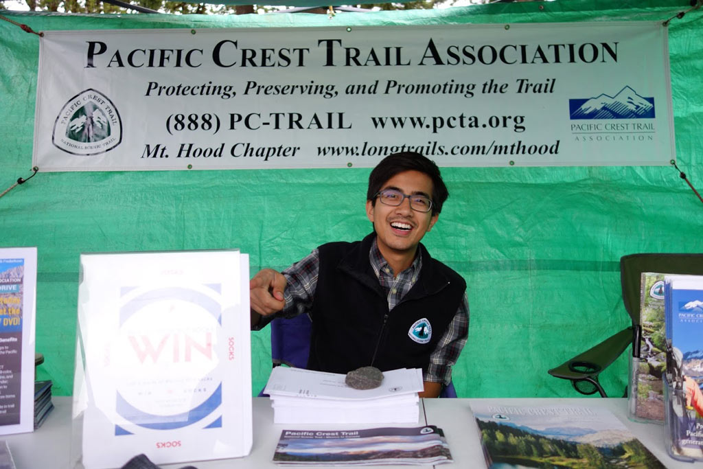 Lanz Nalagan, part of PCTA's philanthropy department, manning our booth.