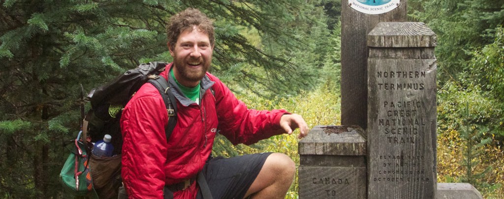 Colin Arisman at the northern terminus of the Pacific Crest Trail.