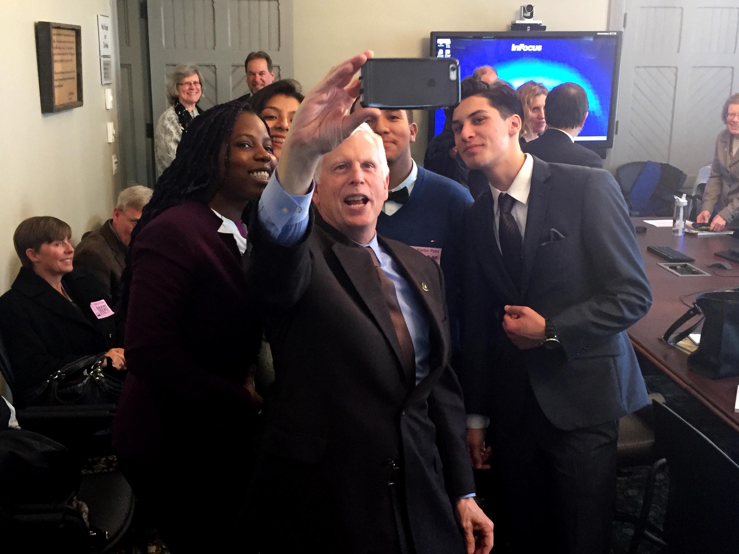 Chief Tidwell, leader of the U.S. Forest Service, takes a selfie with the group after hearing them speak about how important the PCT is to them.