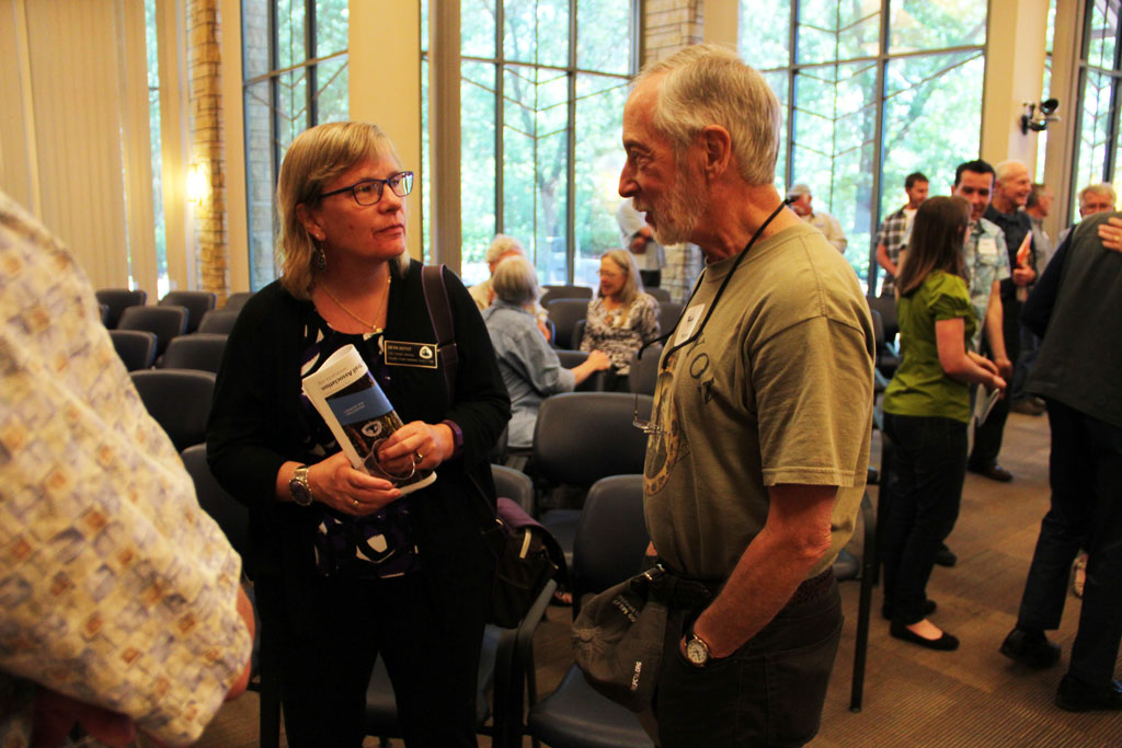 Beth Boyst, PCT Program Manager for the U.S. Forest Service, chats with a guest after the meeting.