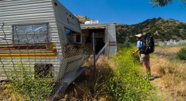 PCT Land Protection program photo with old trailers on private land shown as a threat to the Pacific Crest Trail.