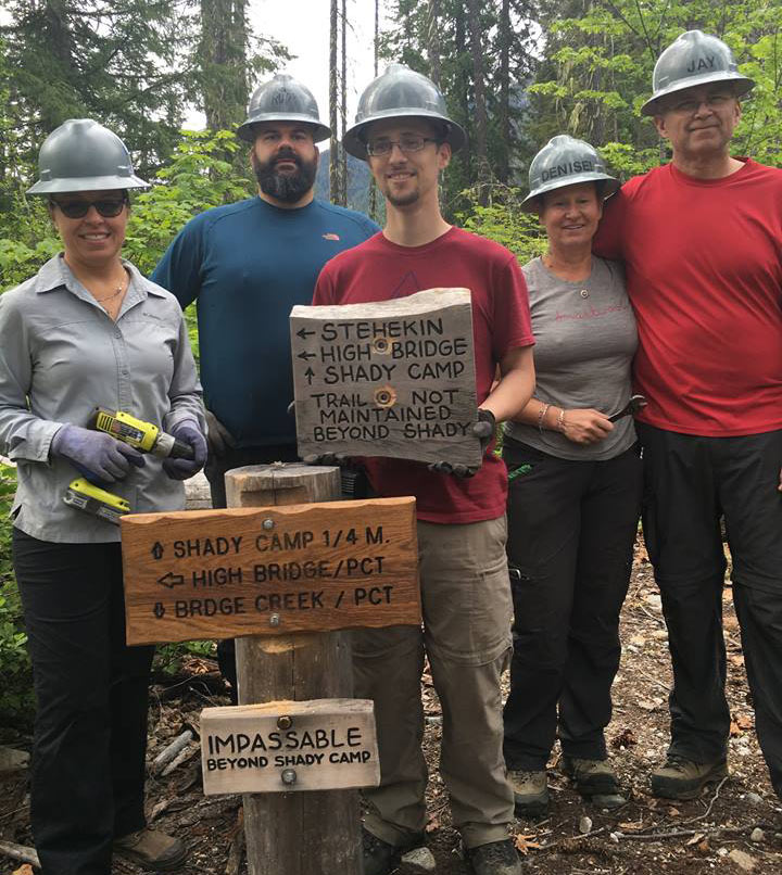 (Left to right) Shannon Cunningham, Rudy Giecek, Dereck Catron, Denise Crafton and Jay Crafton installed news signs along the trail.