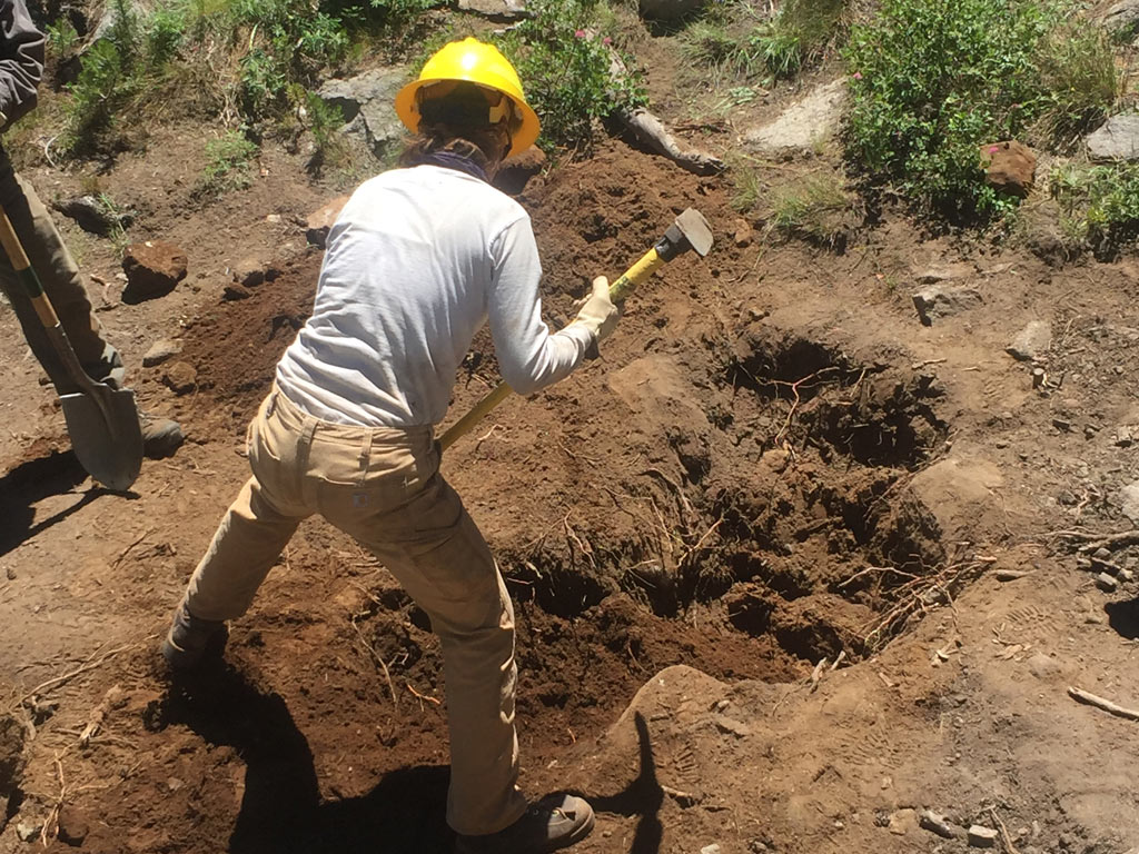 digging a hole at the northern sierra trail skills college in 2016