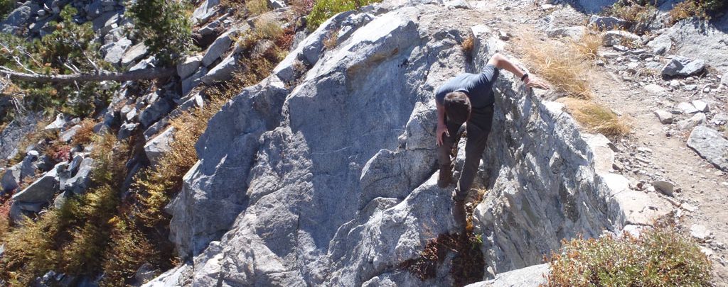 Klamath National Forest’s Sam Commarto investigates a rock wall.