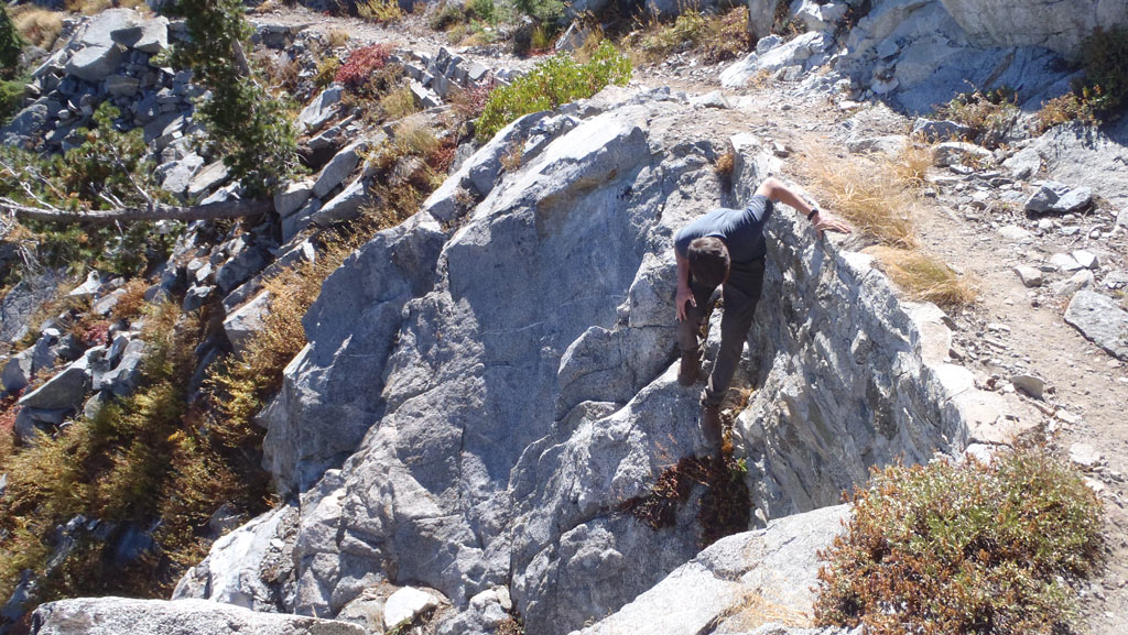 Klamath National Forest’s Sam Commarto investigates a rock wall.