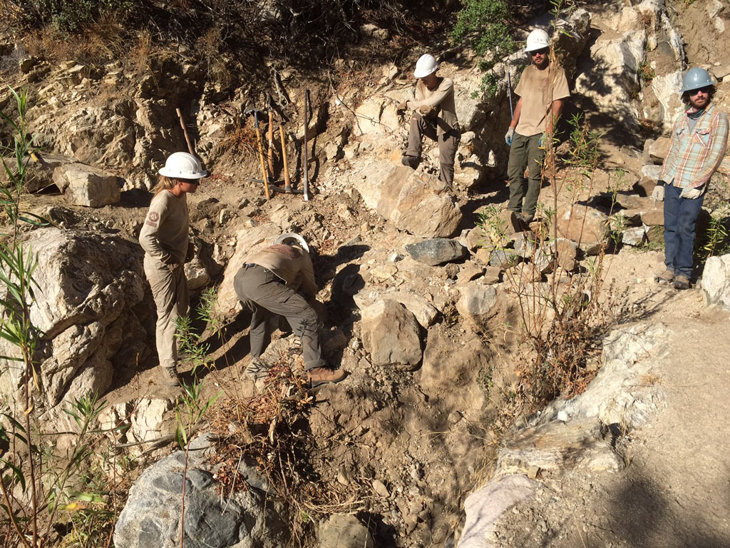 Corp crew and volunteers building a rock retaining wall. Photo by Connor Swift