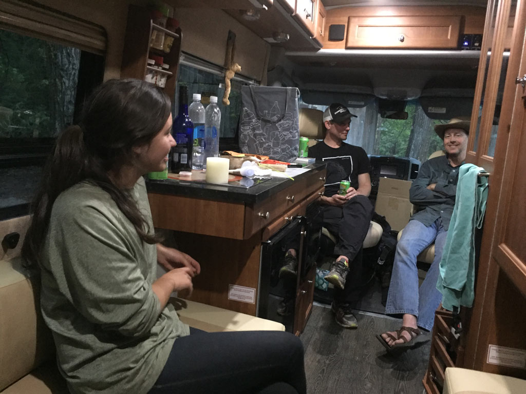 Brenna Hurst, Kevin Broch and Ken Geib hang out near the project site in Ken's RV. Wild Plum Campground.