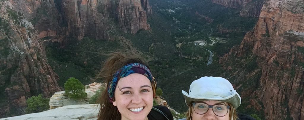 Jacqui Ogle and Sabi Rivera on top of Angels Landing in Zion National Park.