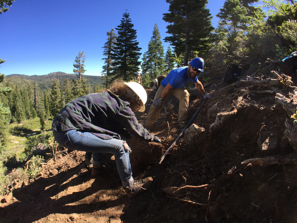 Allyson Wiley and Connor Swift building trail.