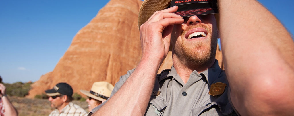Rob Lorez watches a solar eclipse in Arches National Park in 2012. Photo by Andrew Kuhn of the National Park Service.
