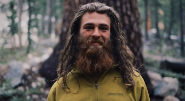 Chris Pickering donated this photo of his friend Cap'n Crunch. And he wrote this great caption, "This is Cap'n Crunch. He epitomizes the thru hiker in my opinion. Even swamped in mosquitos, he was still grinning ear to ear. We thru hiked the A.T. in 2012 not getting a chance to meet, only hearing of one another. And here, on the other side of the country in the middle of the forest surrounded by trees as thick as cars we were reunited much like a family would be. The thru hiking community is a tight knit group of people who are passionate about living and the relationships they make along the way. Our goal is not to run away, rather we are sprinting towards a lifestyle of exploration and the unknown. Why live in one place? There is far too much to see, learn, and experience to sit in one place for too long. Therefore, we hike."