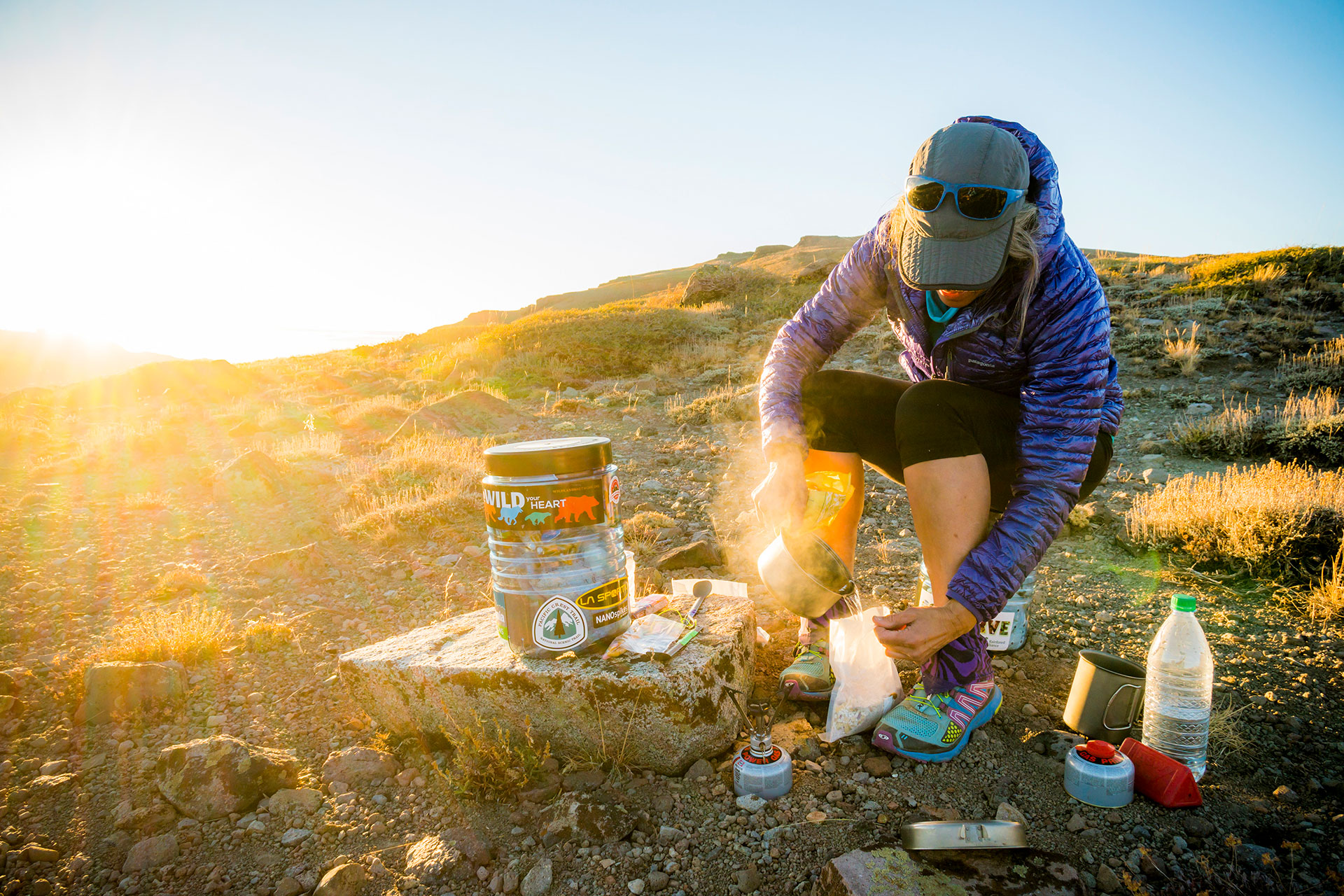 PCT hiker with a bear canister in the sierra
