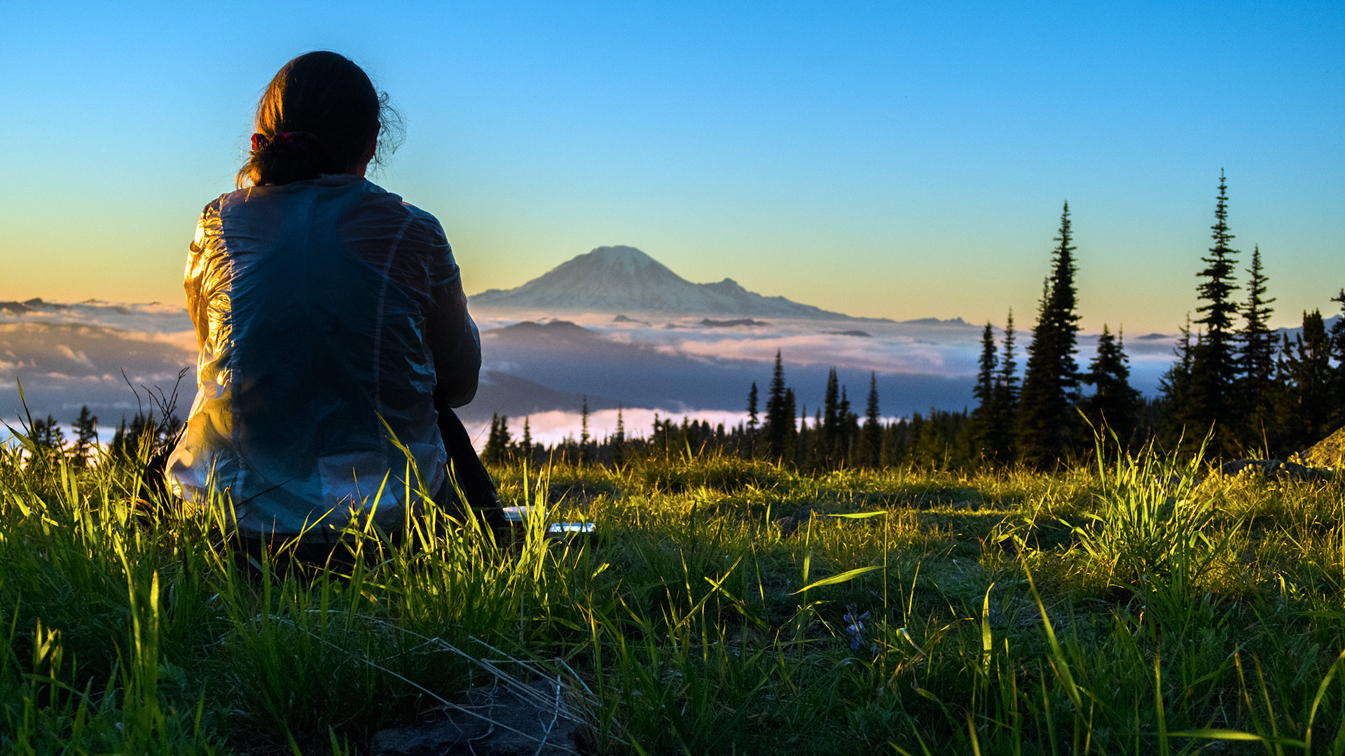 Practice gratitude and kindness. Thousands will follow in your footsteps. "CC' relaxes at the end of the day - enjoying the setting sun and view of Mt Rainier. Photo by Lisa Frugoli