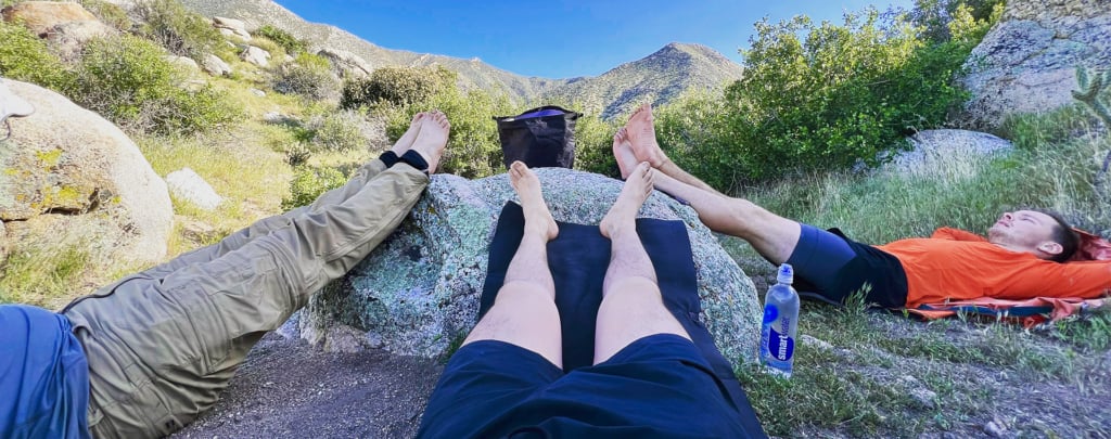 PCT hikers elevate their feet while resting.